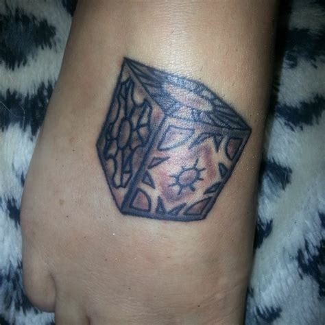 Hellraiser box on my foot | Geometric tattoo, Triangle tattoo, I tattoo