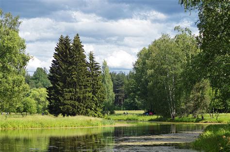 Suburban landscape with a pond. Photograph by Olga Prolygina - Pixels