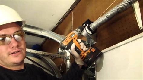 Installing A Garage Door Part 4- Tensioning the EZ- Set Torsion Spring - YouTube