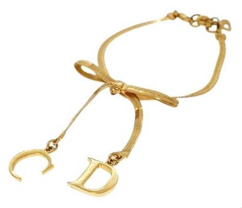 Dior Gold Ribbon Motif Logo Motif Bracelet in 2021 | Gold ribbons ...