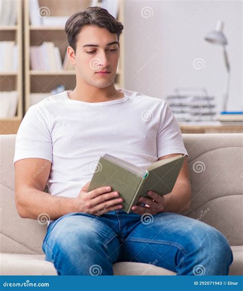 Man Reading Book Sitting in Couch Sofa Stock Image - Image of ...