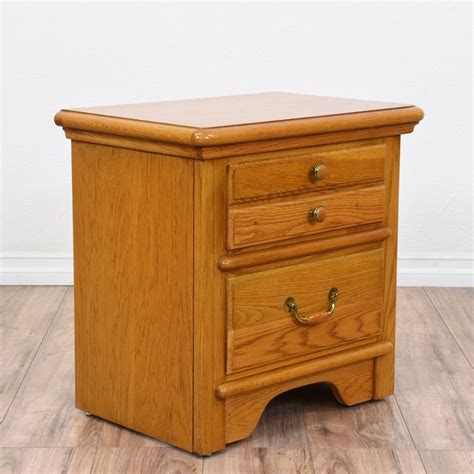 This "Lexington" nightstand is featured in a solid wood with a glossy ...