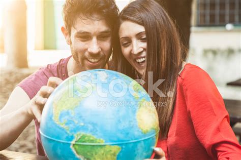 Young Couple Looks The World Map Stock Photo | Royalty-Free | FreeImages