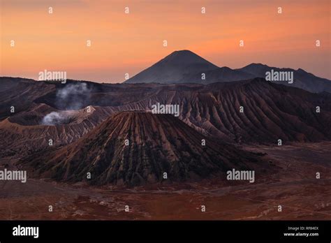 Volcanic pipes with smoking volcano Gunung Bromo, Mt. Batok, Mt. Kursi ...