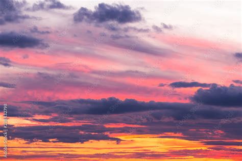 Beautiful soft dramatic sunset orange pink sky with clouds background Stock Photo | Adobe Stock