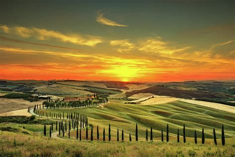 Tuscany, rural sunset landscape. Countryside farm, white road an ...