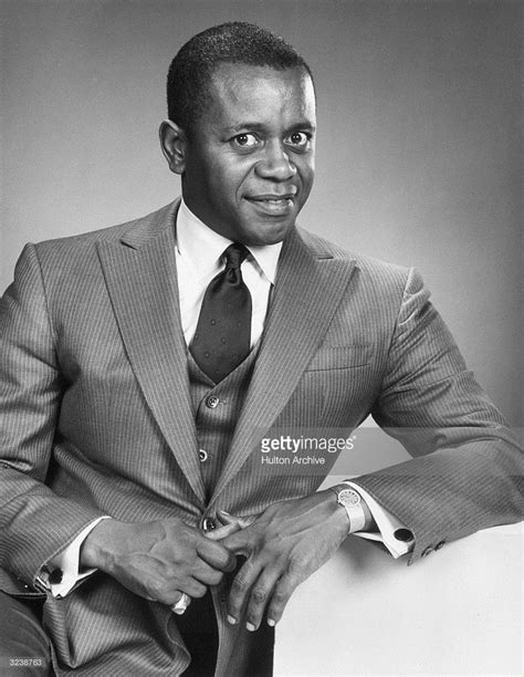 Studio portrait of comic actor Flip Wilson smiling while wearing a ...