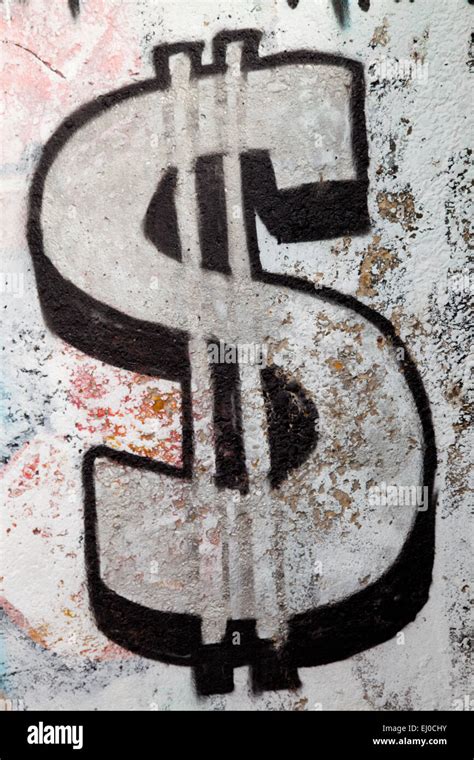 Graffiti of a sign of the dollar Stock Photo - Alamy