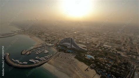 Jumeirah Beach near Burj Al Arab hotel in Dubai, UAE. Helicopter view ...