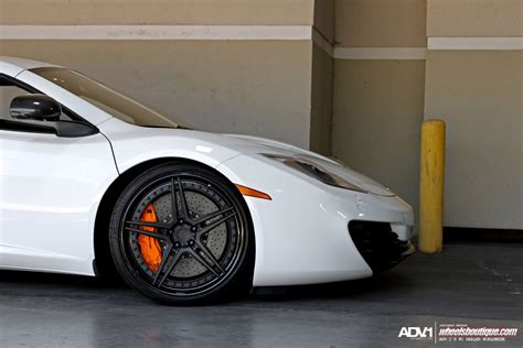 Fascinating White Mclaren 12c With Orange Brake Calipers — CARiD.com ...