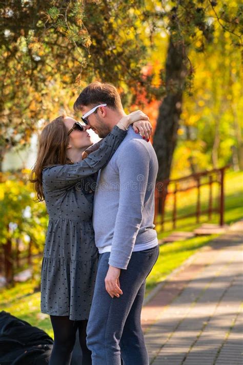 Affectionate Young Woman Hugging Her Husband Stock Image - Image of outdoors, passion: 162472163