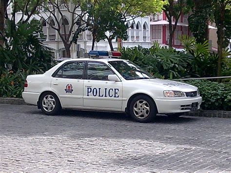 Singapore Police Force car outside the National Library of Singapore ...