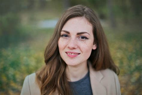 Woman Wearing Brown Cap and White Long Sleeve Shirt · Free Stock Photo