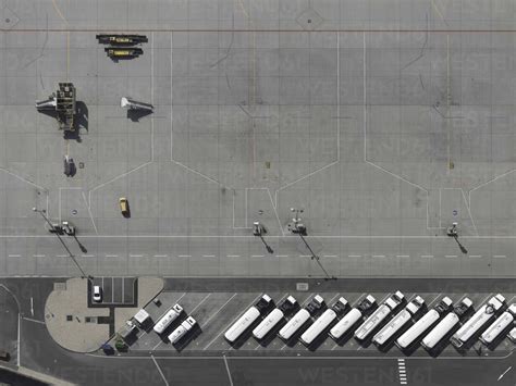 Aerial view service vehicles parked on tarmac at airport stock photo