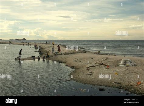 Jakarta, Indonesia. People having recreational time on the beach of ...