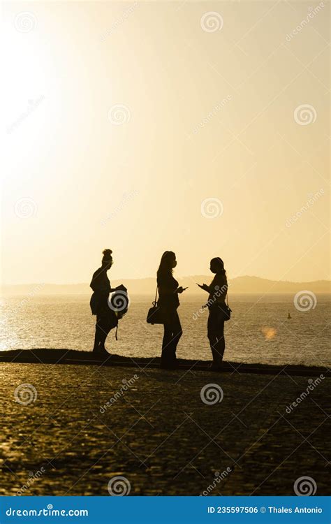 Silhouette of Group of People Against the Sunset Editorial Photo ...