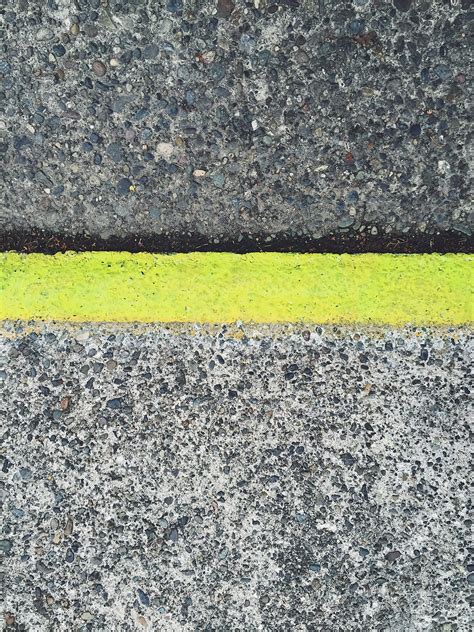 "Painted Yellow Curb Along Sidewalk And Street, Close Up" by Stocksy ...