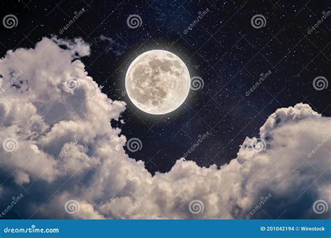 Beautiful Shot of the Full Moon in the Night Sky Full of Stars and Cumulus Clouds Stock Photo ...