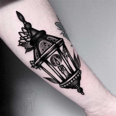 Blackwork lantern tattoo on the forearm - Tattoogrid.net