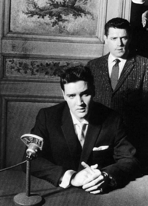 Elvis - (With long time Elvis friend and confidant, Charlie Hodge) at a French press conference ...