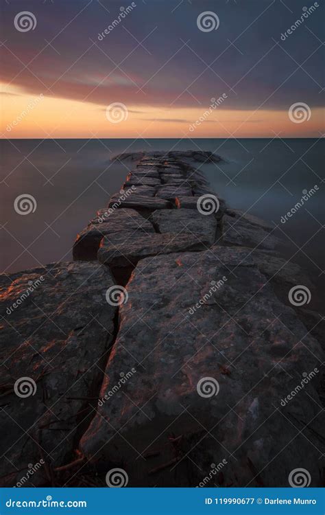 Bright`s Grove Rocky Sunset Stock Image - Image of beach, peaceful ...