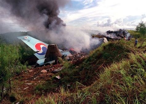 The tail section of Korean Airlines flight 801 stands at the crash site.