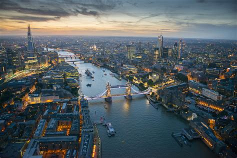 Aerial view of Tower Bridge and the River Thames at night, London ...