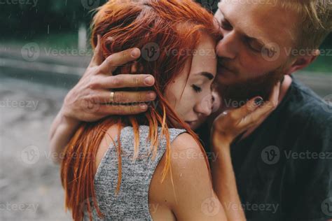 beautiful couple hugging in the rain 11454535 Stock Photo at Vecteezy