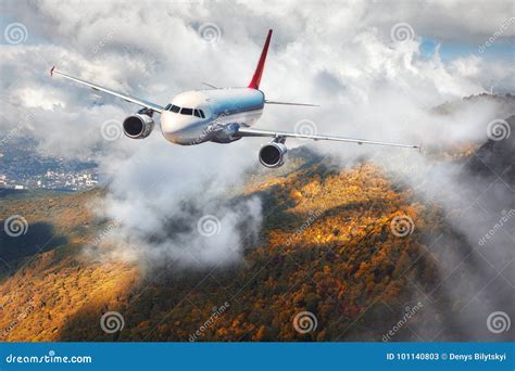 Airplane is Flying in Clouds Over Mountains with Autumn Forest Stock Image - Image of nature ...