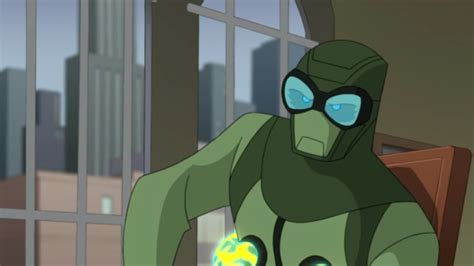 an animated character in a green suit with blue eyes holding a glowing ball while standing next ...