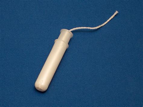 a tampon with plastic applicator - Earth Buddies