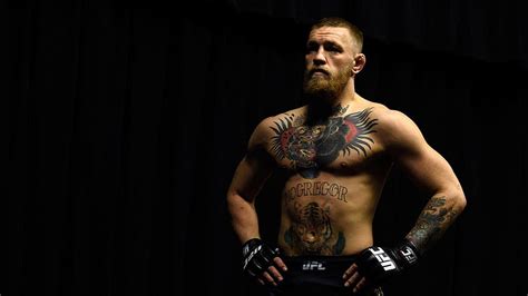 Conor McGregor With Tattoos Standing In Black Background Conor McGregor ...