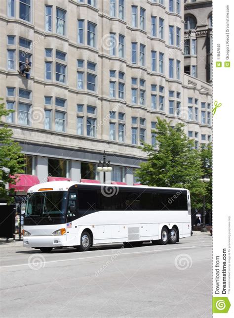 White tour bus in the city stock photo. Image of tourism - 11842640