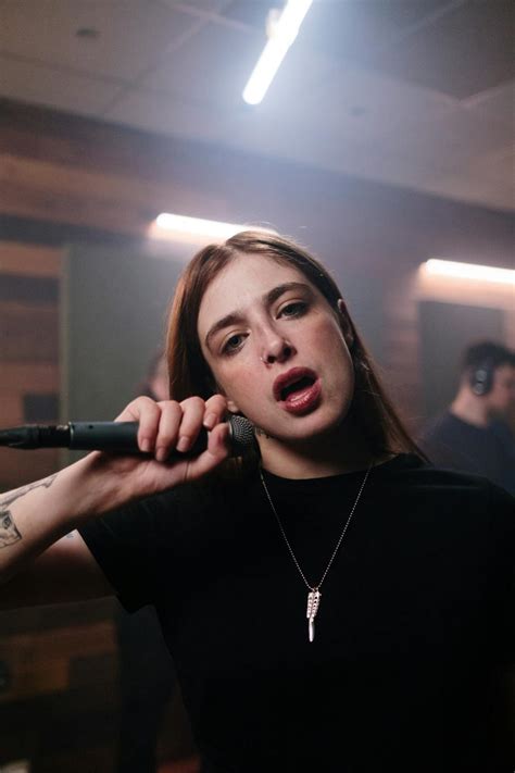 A Woman in Black Shirt Holding a Microphone · Free Stock Photo