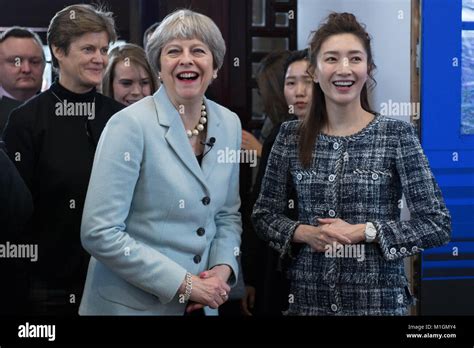 Prime Minister Theresa May is greeted by Chinese actress Jiang She Ying ...