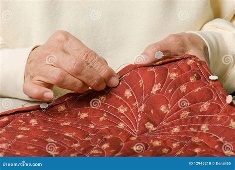 Hand binding a quilt. stock photo. Image of quilter, needle - 12945210