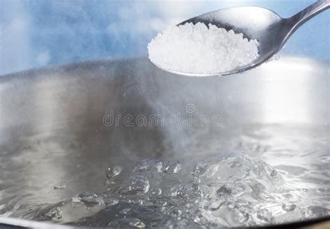 Add Salt To Boiling Water in a Metal Pan Close-up Stock Image - Image of heat, drop: 142148127