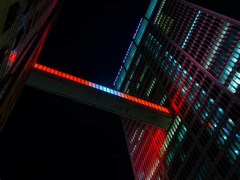 phillip k. smith III creates 'floating bar of light' for detroit skybridge