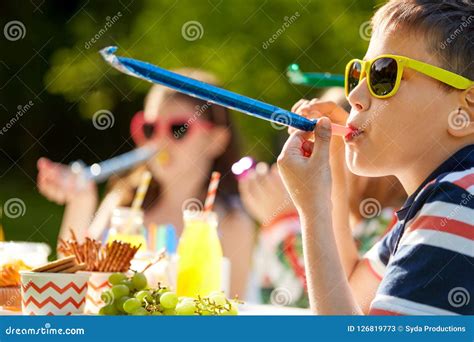 Kids Blowing Party Horns on Birthday in Summer Stock Image - Image of horn, concept: 126819773