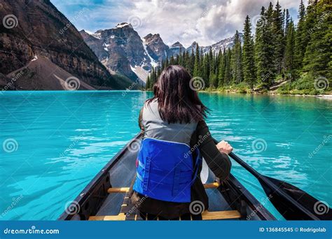 Tourist Canoeing on Moraine Lake in Banff National Park, Canadian Rockies, Alberta, Canada Stock ...