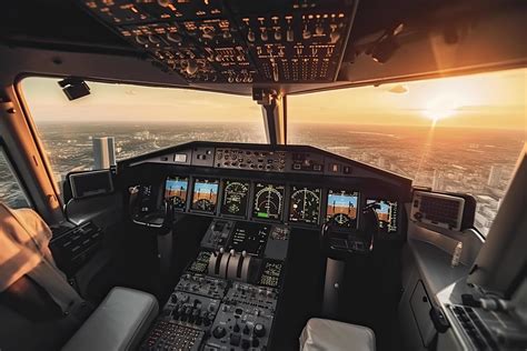 Cockpit of modern passenger jet aircraft. Pilots at work. Aerial view ...