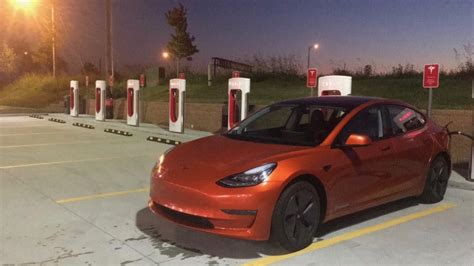 orange-tesla-model-3-supercharger-4 - TESLARATI