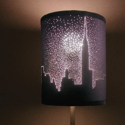 Poke holes through a black lamp shade to make unique and interesting ...