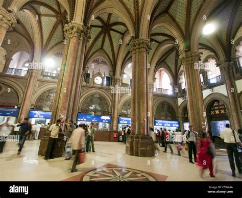 People inside Chhatrapati Shivaji Terminus train station previously named Victoria Terminus in ...