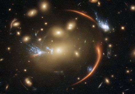 Bad Astronomy | Hubble image of a galaxy cluster's gravity warping space | SYFY WIRE