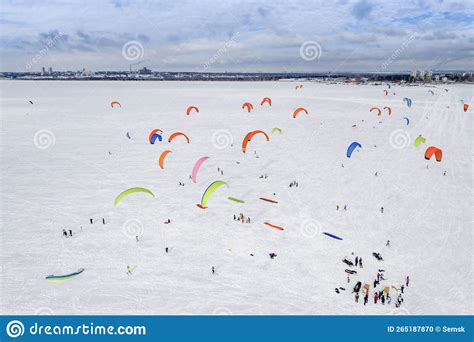 Aerial View of Snowkiting Competitions with Colored Parachutes on a ...