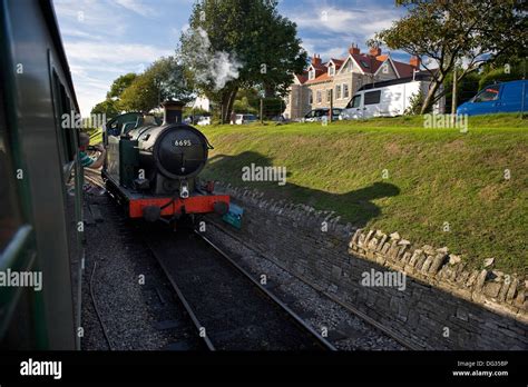 A steam locomotive on the Swanage Railway about to depart Swanage ...