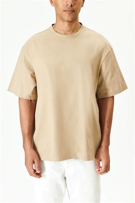 Download premium image of Man in a beige tee mockup 2463899 | Beige t shirts, Beige tees, Shirt ...