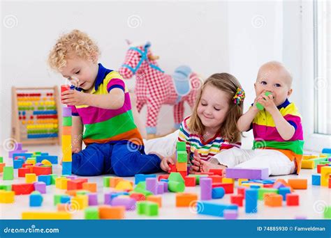 Kids Playing with Colorful Toy Blocks Stock Photo - Image of nursery ...