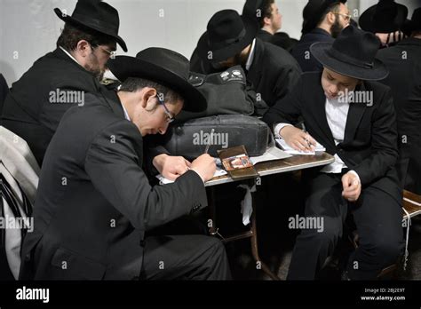 Young religious Jewish men write personal prayer to the Lubavitcher ...